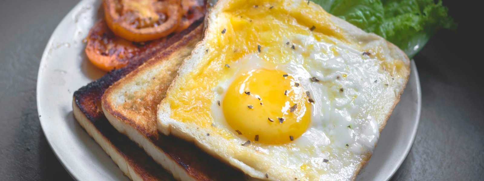 Diner breakfast plate with eggs, bacon and toast