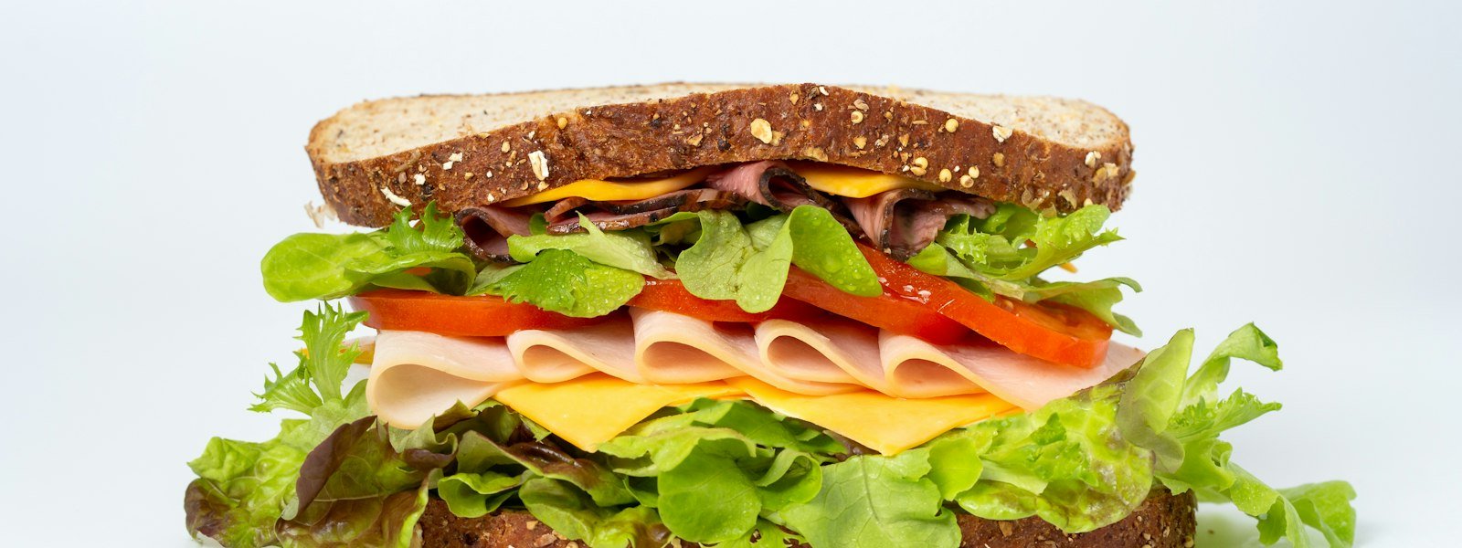 Italian deli sandwich with sliced meats and cheese