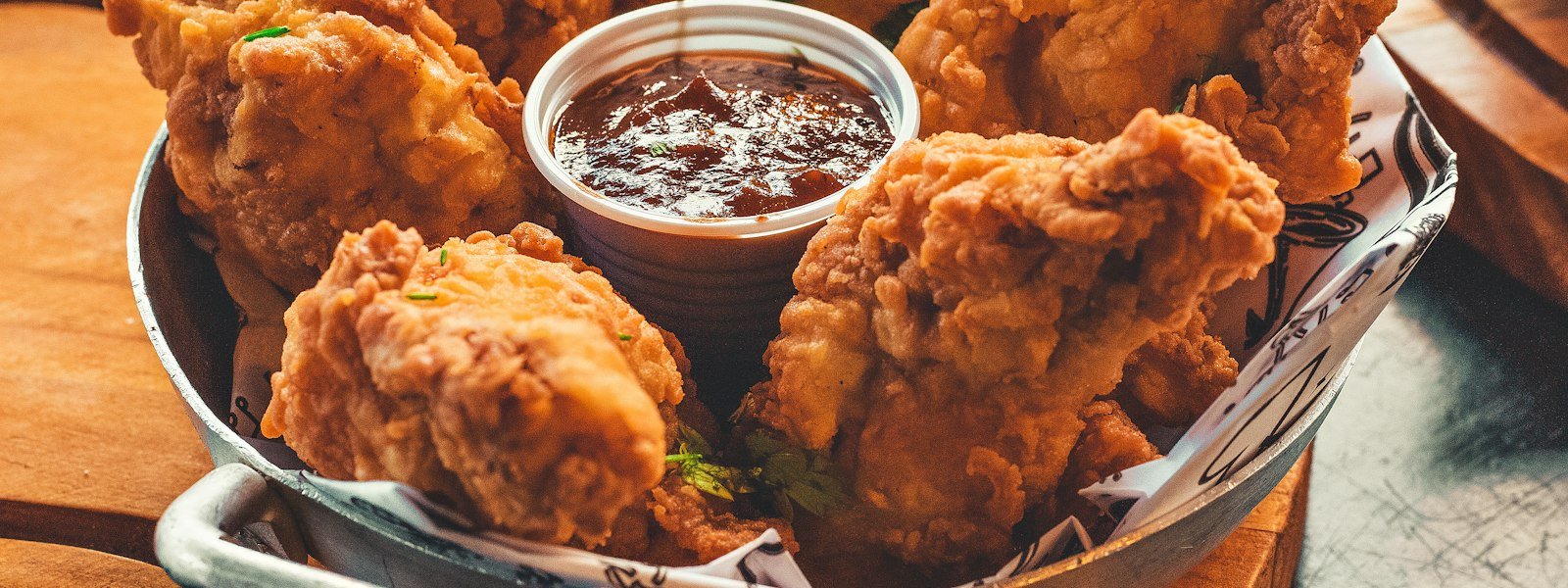 Bucket of crispy fried chicken pieces