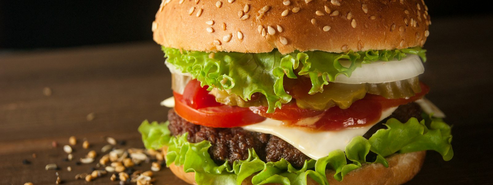 Burger with golden fries on a tray