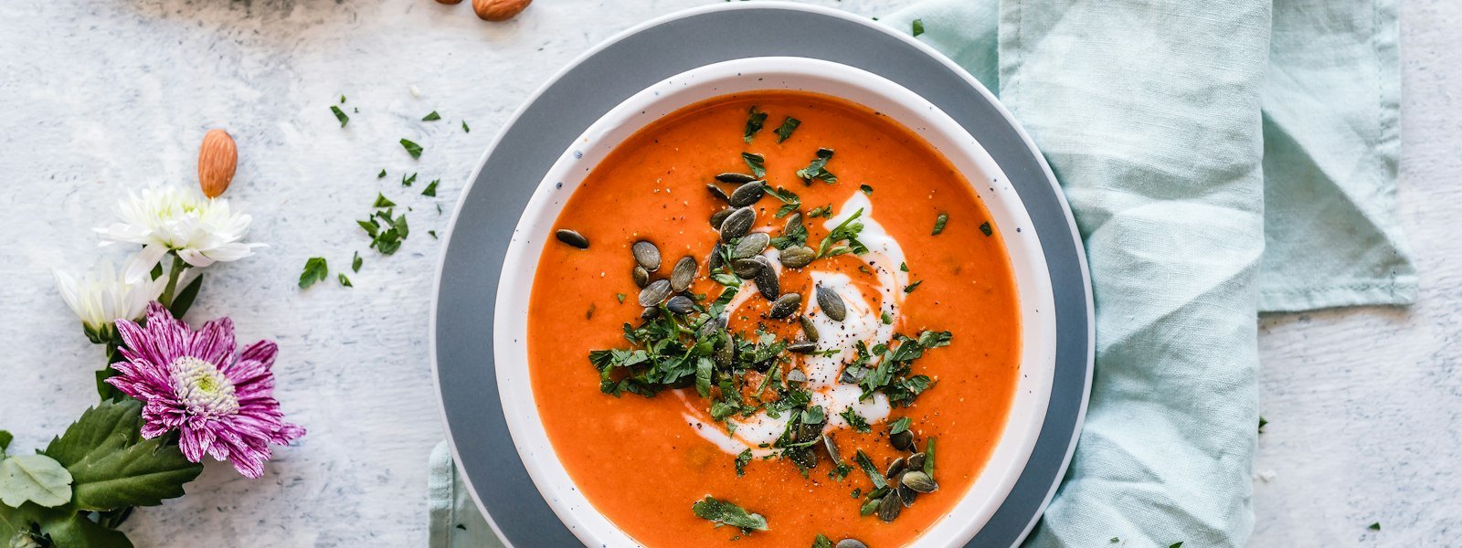 Bowl of creamy soup with fresh bread on the side