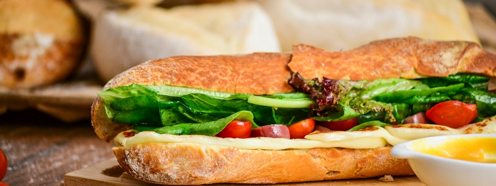 Fresh sub sandwich with deli meat and vegetables