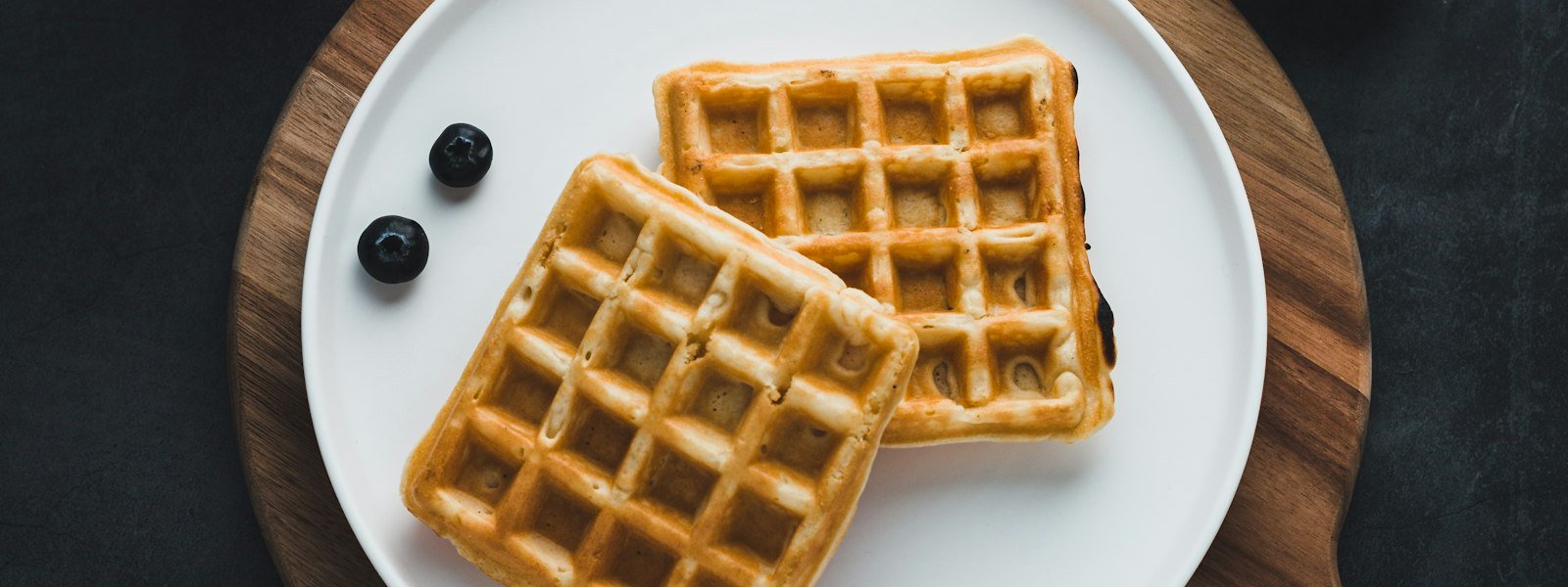 Golden waffles with butter and syrup