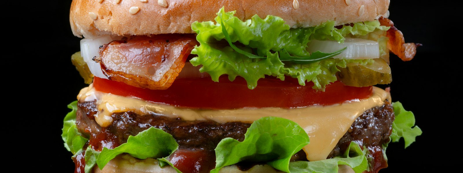 Cheeseburger with fresh toppings on a toasted bun